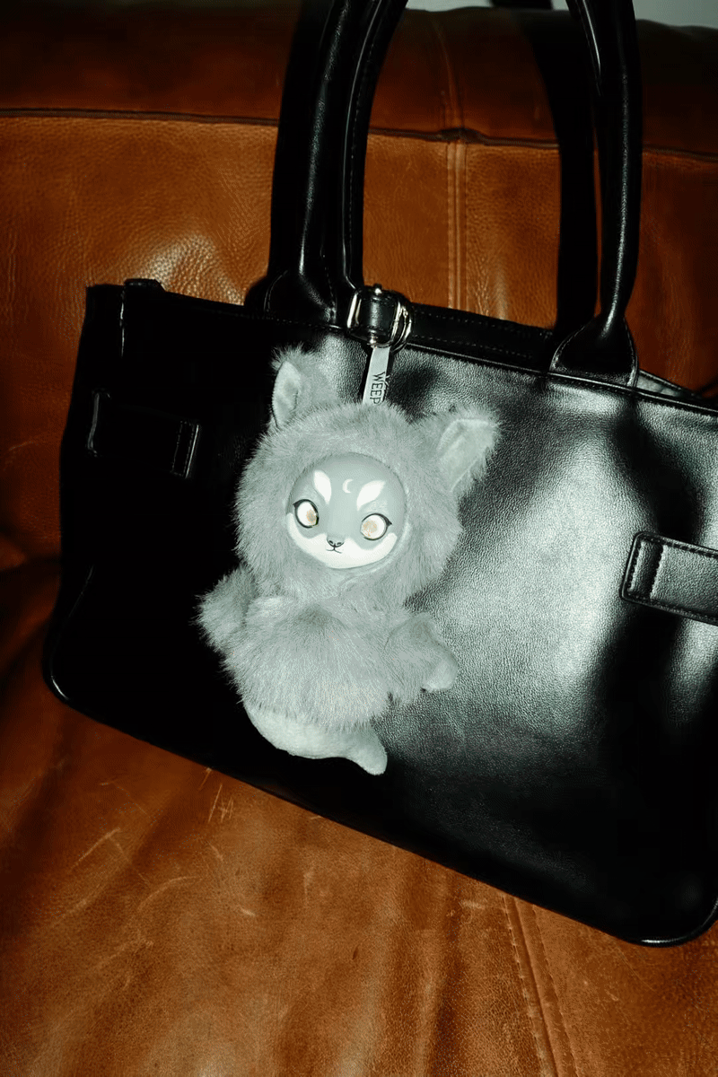 Gif style of 5 images of fluffy plush charms against different backdrops to showcase the animal designs. 